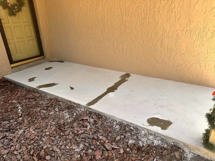 Concrete patio before epoxy coating in Lakeland, FL