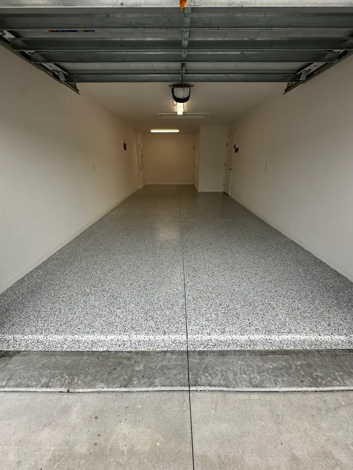 Light flake epoxy floor in a finished garage