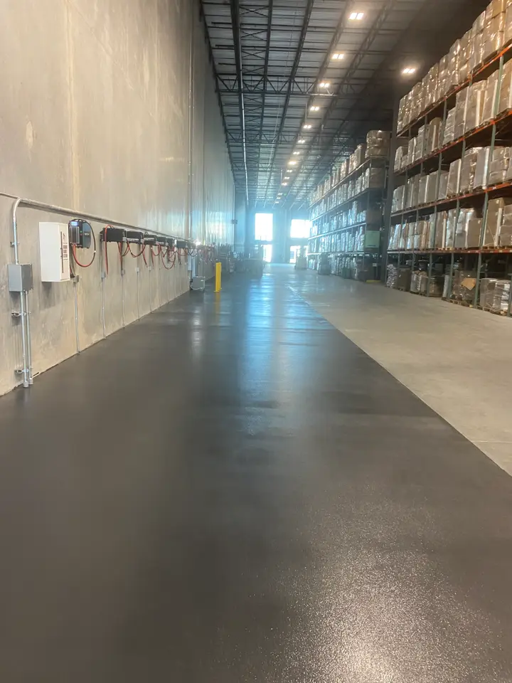 Commercial epoxy floor in a warehouse aisle