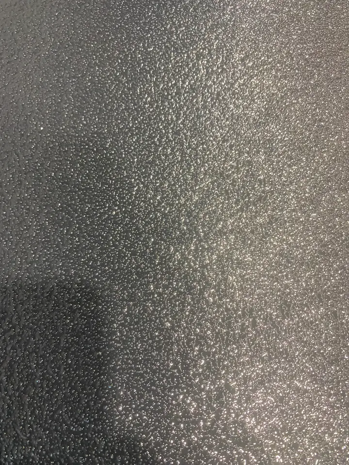 Close up of a commercial flake epoxy floor