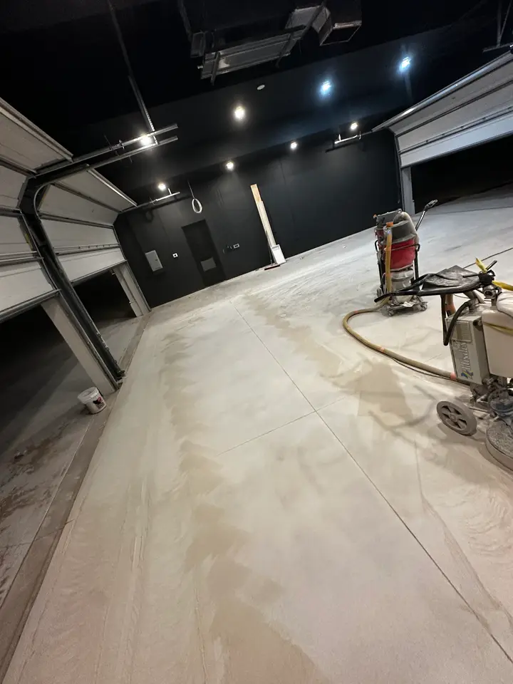 Concrete grinding in progress on a commercial floor